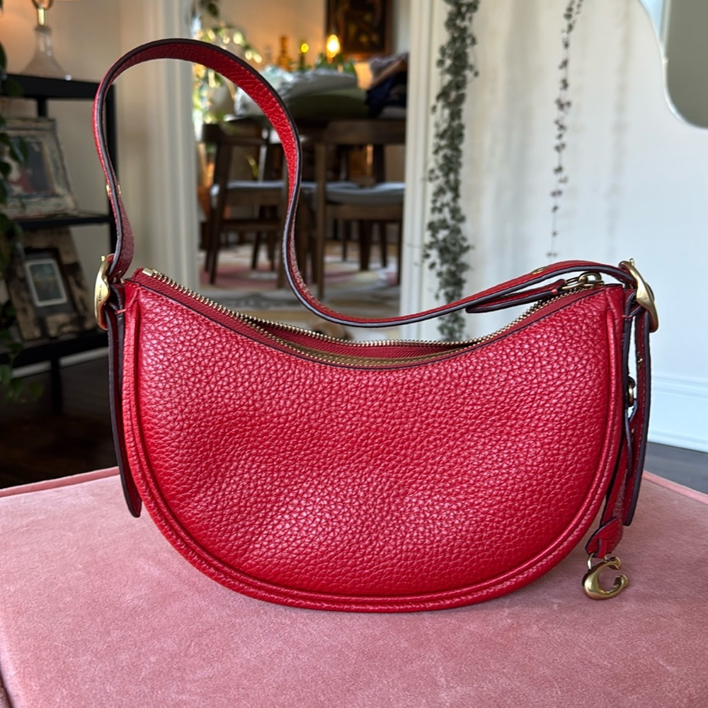 Coach Luna in sport red.